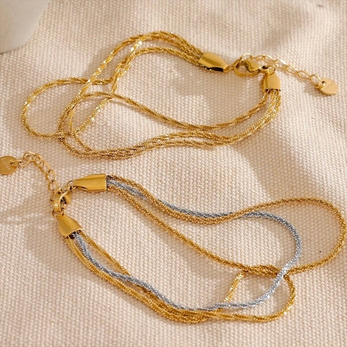 Bracelet multirangs en acier inoxydable doré et argenté, bijou raffiné et tendance pour femme.