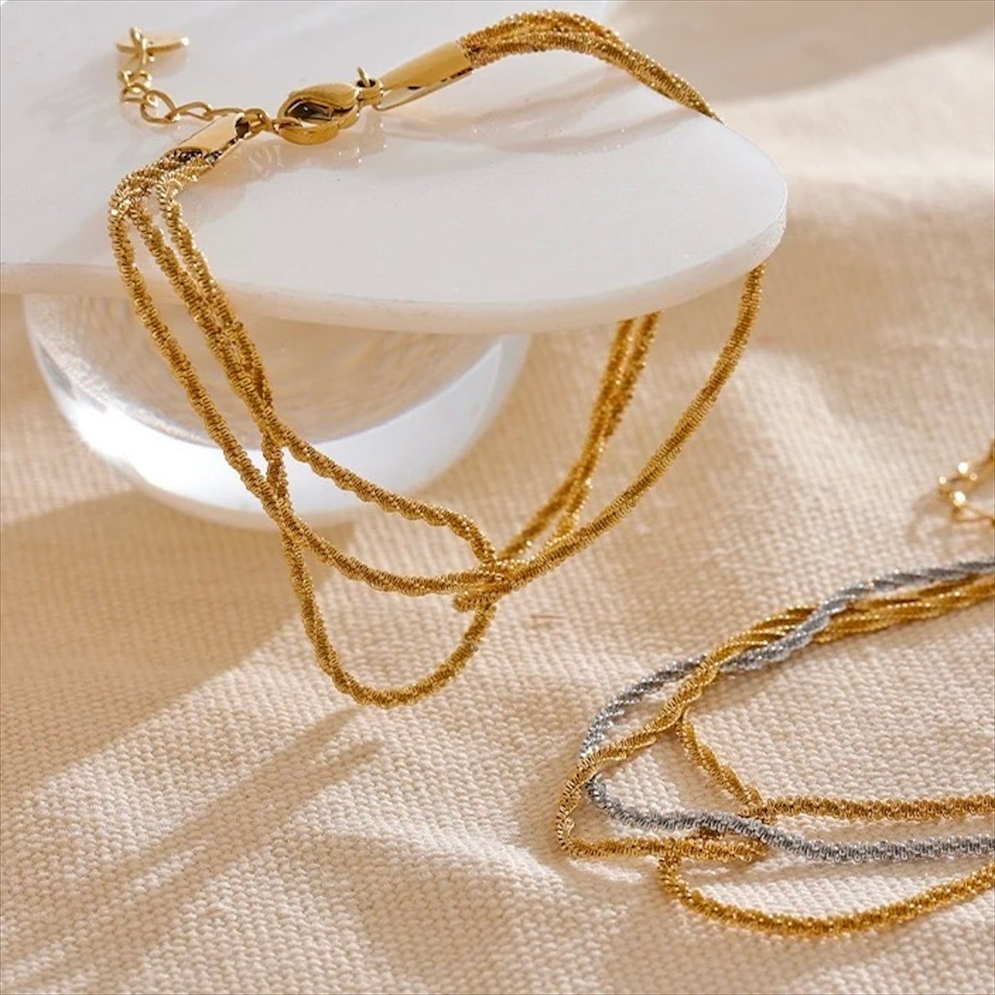 Bracelet multirangs en acier inoxydable doré et argenté, bijou raffiné et tendance pour femme.